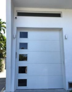 White garage door outside view during opener repair in Lakewood