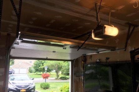 Examining an overhead opener mechanism in a residential Puyallup WA garage.