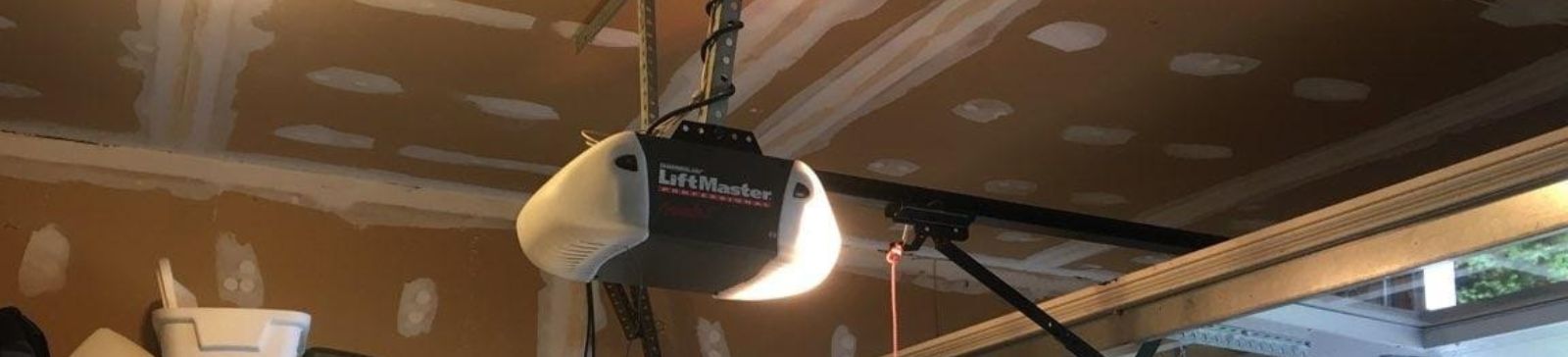 Examining an overhead opener mechanism in a residential Puyallup WA garage.