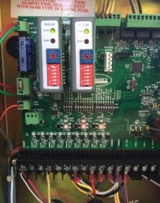 Close-up of garage door opener control board and wiring during diagnostic service in Bellevue