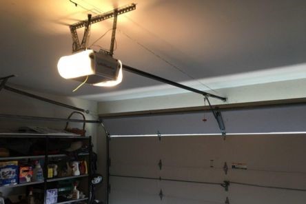 LiftMaster garage door opener installed in a Bellevue garage, showing opener and partially open door