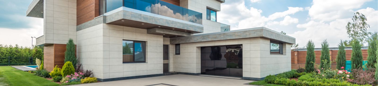 Modern residential home exterior with a new garage door, representing garage door repair and installation service areas in Seattle.
