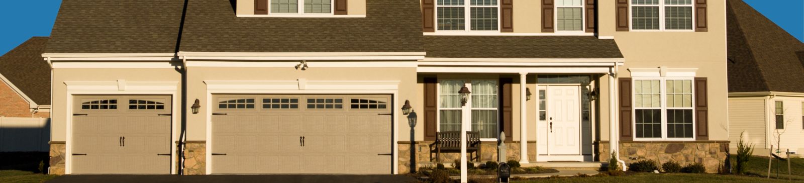 Front view of a Spanaway home with double overhead garage doors