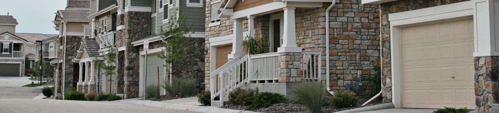 Front view of a modern home with a newly installed garage door, representing professional garage door repair and installation services in Tacoma, WA.