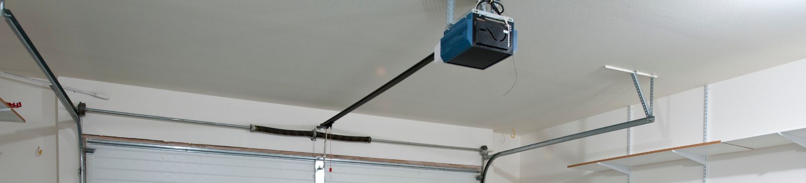 Modern garage interior with an overhead garage door opener, representing expert garage door repair and installation services in Renton, WA.