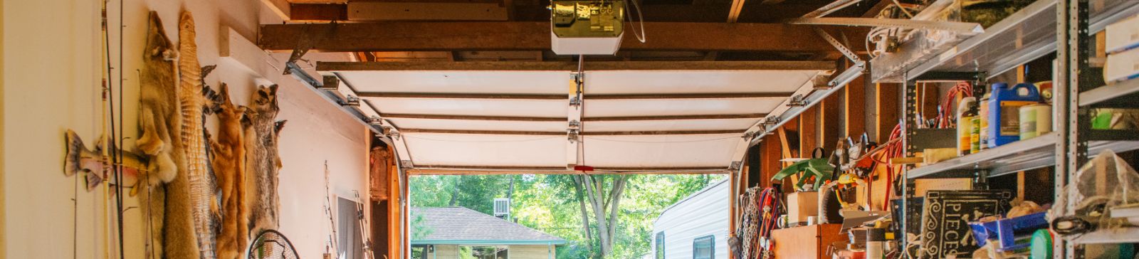 Interior view of a well-organized, clutter-free garage with neatly stored tools, bikes, and equipment, illustrating the importance of garage cleaning and organization.