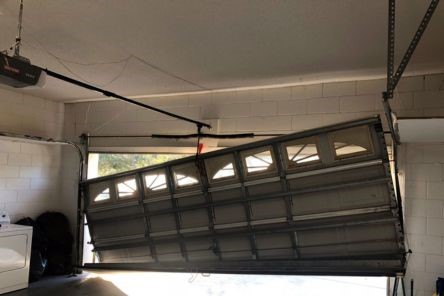 Close-up of the garage door mechanism and new door being installed inside a garage in Everett, WA.