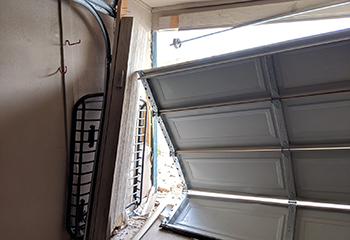 Interior view of a garage showing the new garage door tracks and hardware installed.