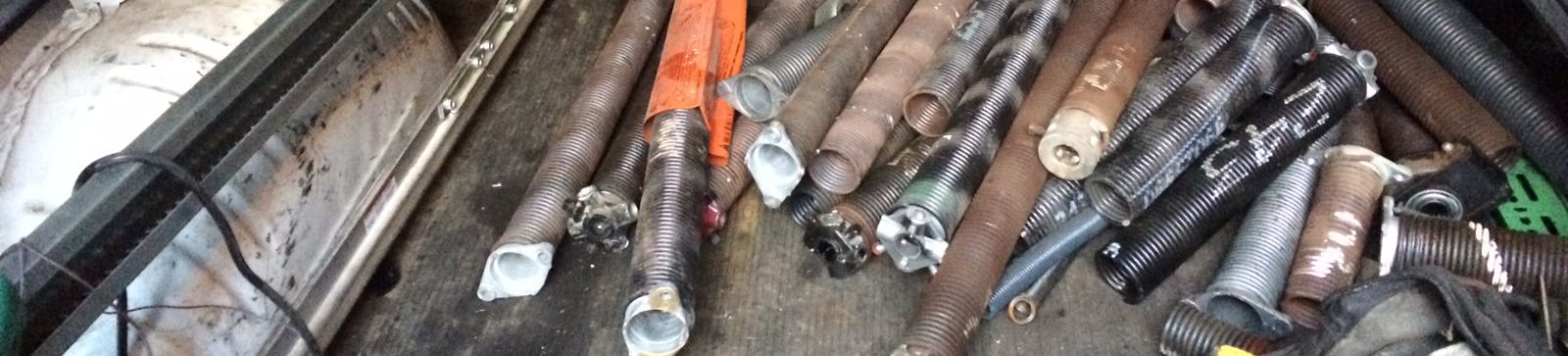 Detailed view of new garage door springs installation and hardware upgrade on Tacoma, WA residential garage system