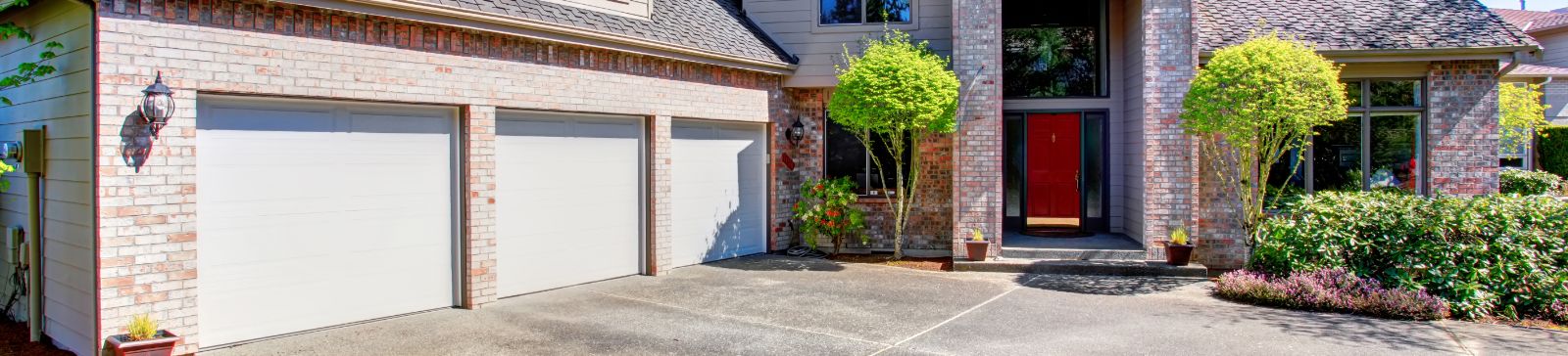 Exterior of a Paine Field-Lake Stickney house with double white overhead garage doors
