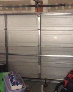 Interior view of a garage with newly installed springs near Everett, ensuring smooth door operation.