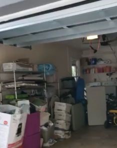 Garage door repair in progress with new tracks being installed in Everett.
