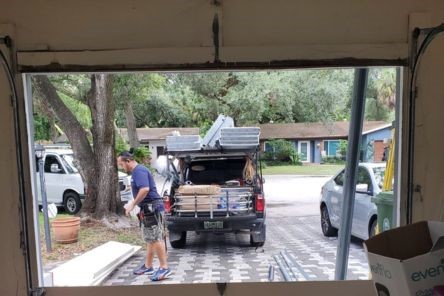 Garage door repair in progress with new tracks being installed in Everett.