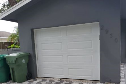 Garage door repair in progress with new tracks being installed in Everett.